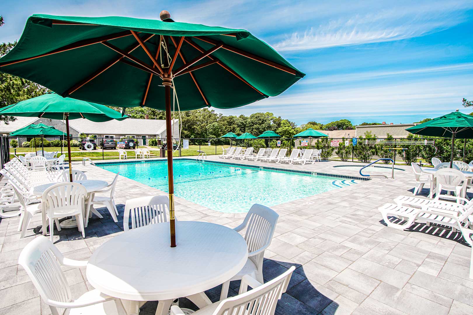 A relaxing swimming pool area at VRI's Brewster Green Resort in Massachusetts.